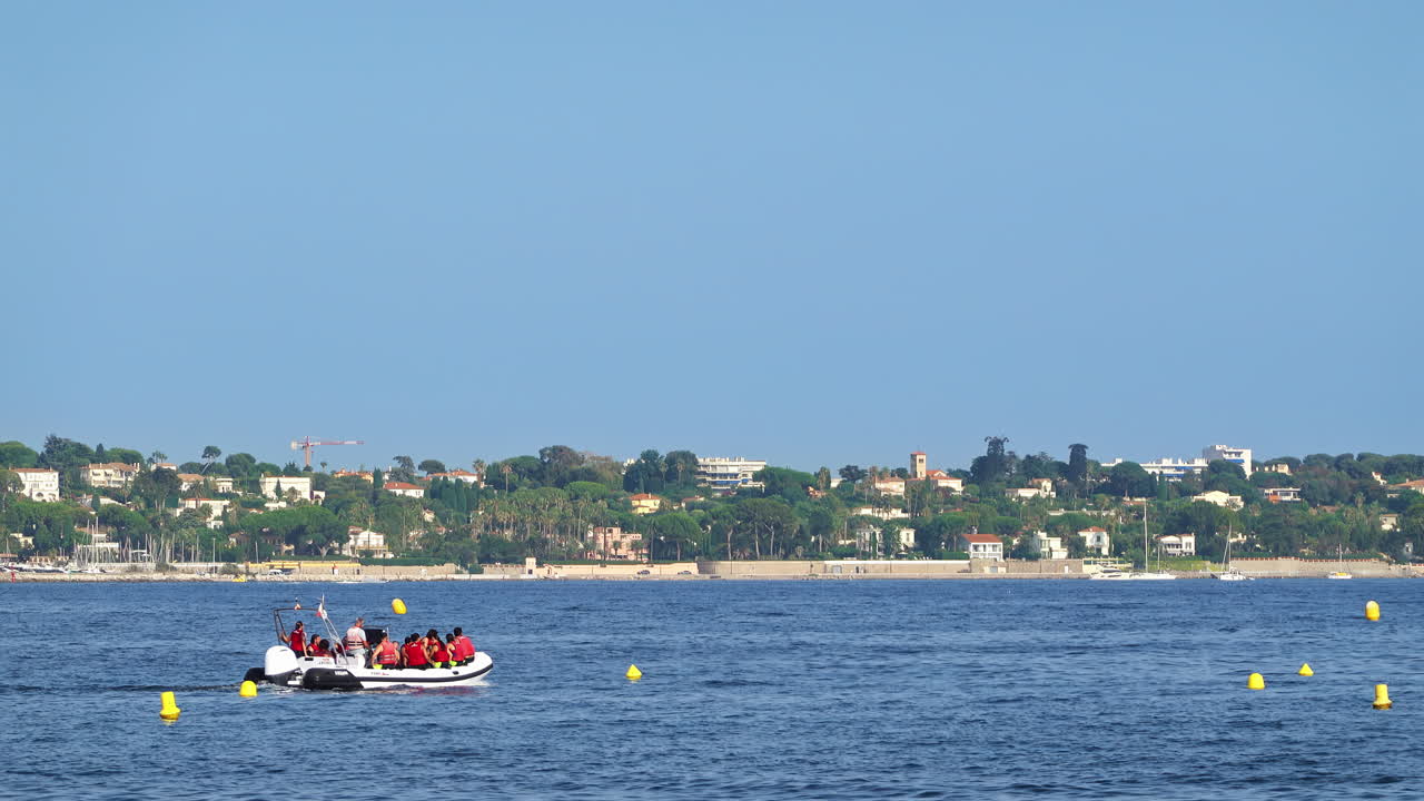 People moving on a boat in the water in Golfe-Juan, France