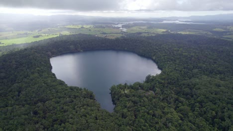 Aerial-View-Over-Volcanic-Lake-Eacham-In-North-Queensland,-Australia---drone-shot