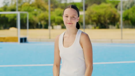 portrait of young hockey teen standing with arms