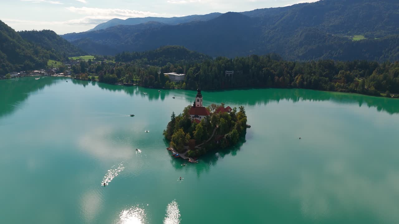 Scenic view of Bled Island with church, serene lake, Slovenia vibe
