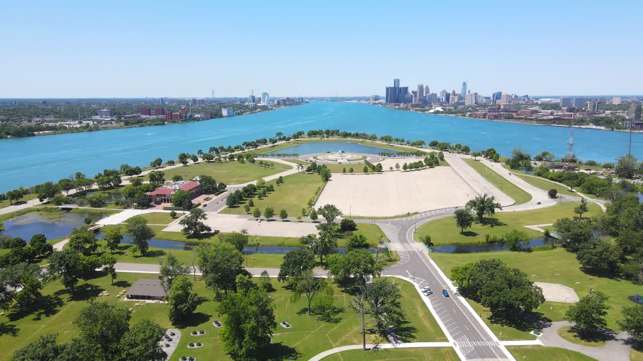 Aerial view of Belle Isle Park on the Detroit River, with downtown Detroit skyline visible in the background