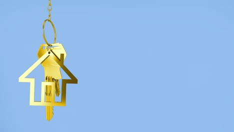 Animation-of-golden-house-keys-against-copy-space-on-blue-background