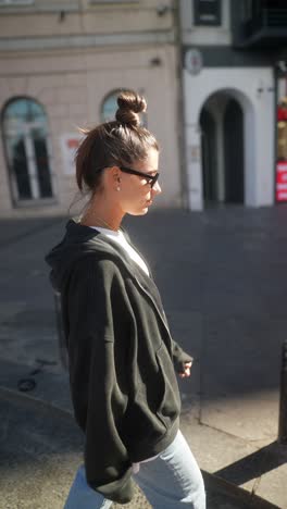 woman in streetwear outfit on city street