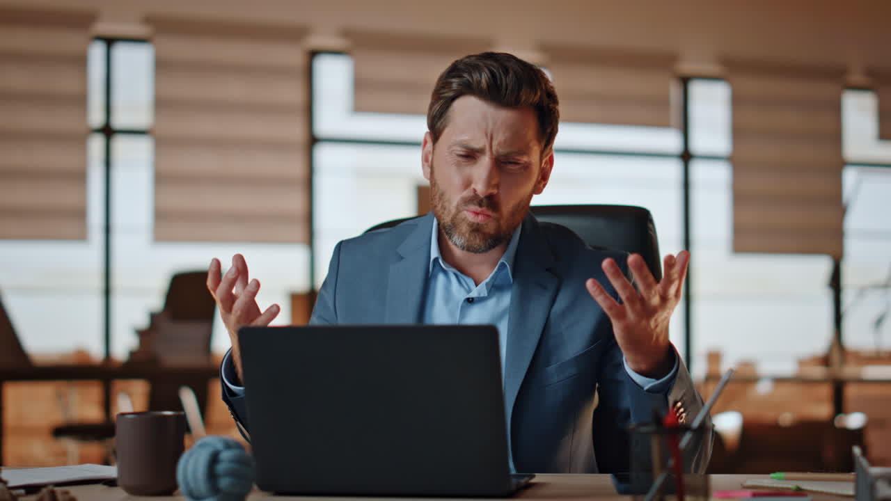 Disappointed man reacting fail at private workplace. Loser hitting ...