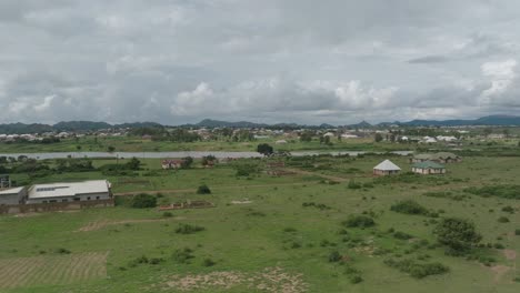 Aerial---lake-and-rural-Community,-spinning-shot