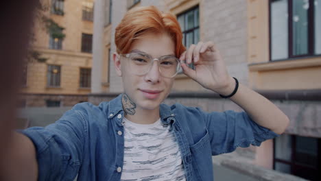 young person taking a selfie outdoors
