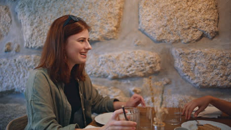 two women enjoying a meal at a restaurant