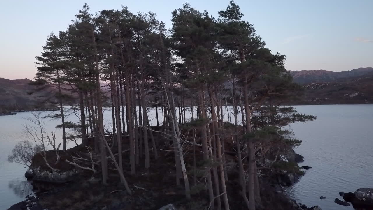 Aerial footage over Loch Druim Suardalain looking towards Suilven mountain in Sutherland, Scottish Highlands, Scotland