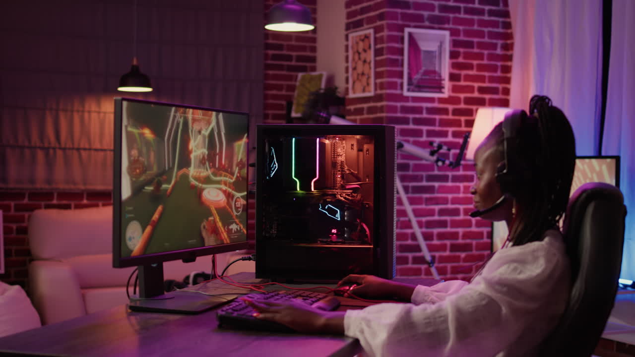 African american gamer girl using pc gaming setup aving a good time playing multiplayer online action game