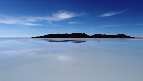 sparse and spacious nature background: blue sky reflects in salt lake