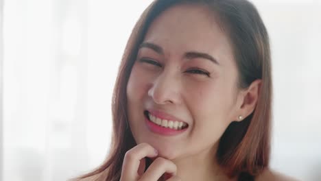 close up of very beautiful asian woman smiling in a very cute way and very happy