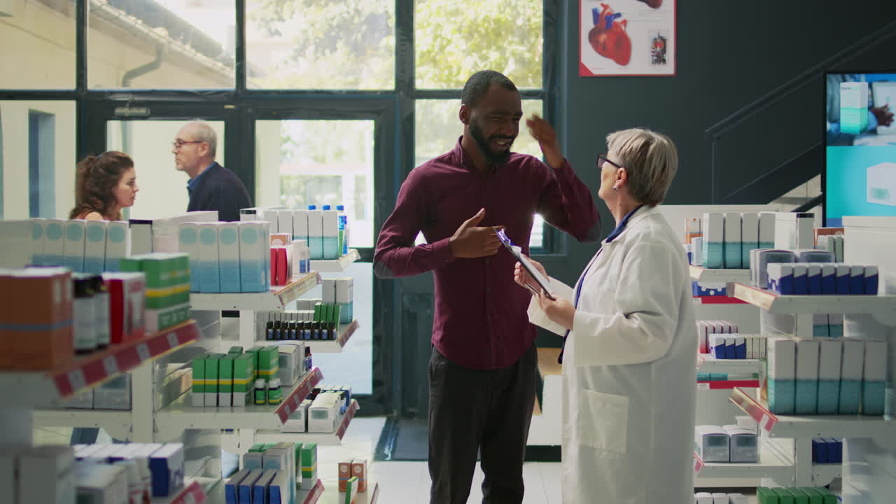 Pharmacist assisting a patient in a pharmacy