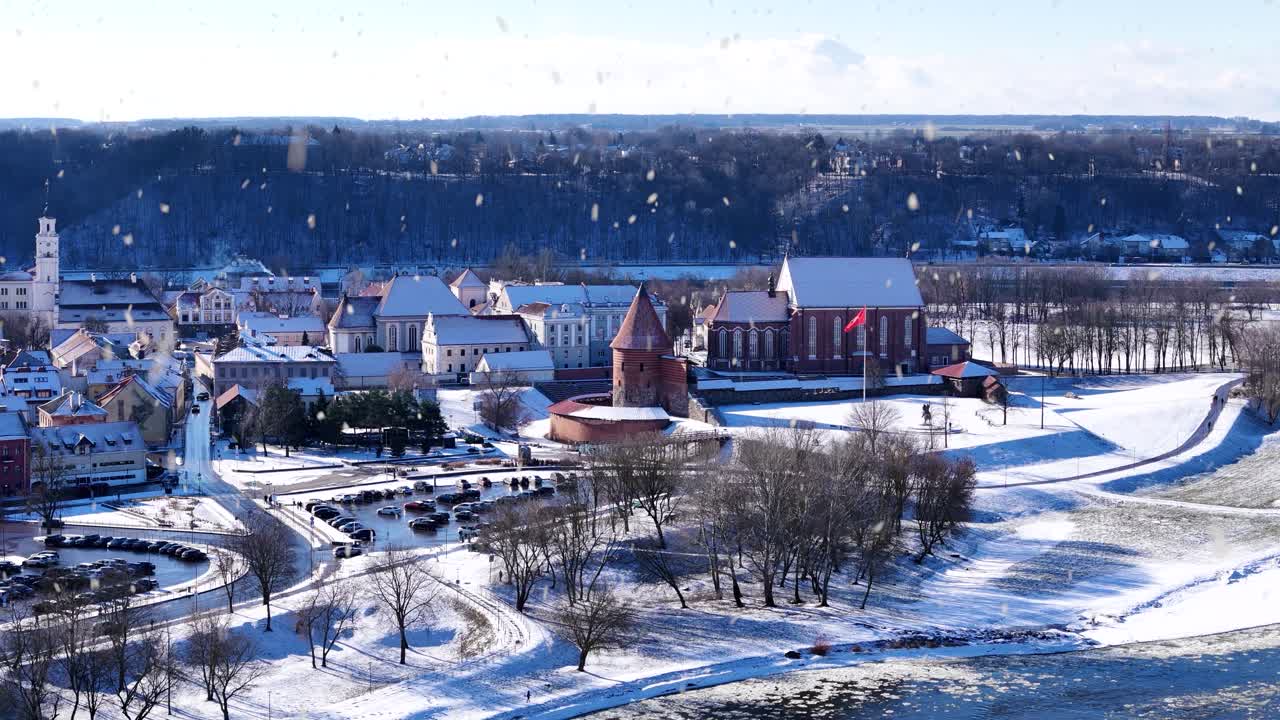 Kaunas castle and oldtown during snowfall, aerial view