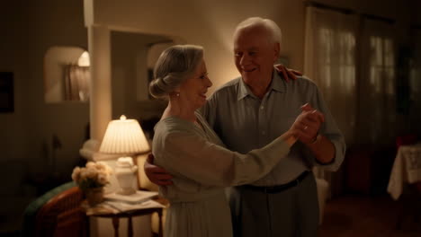 an elderly couple dancing together at home