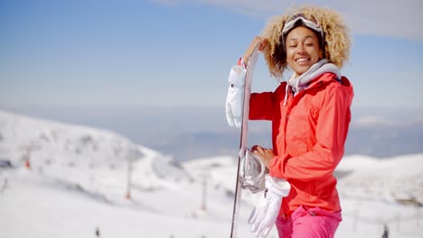 Confident-skier-with-skis-and-gloves-on-hill