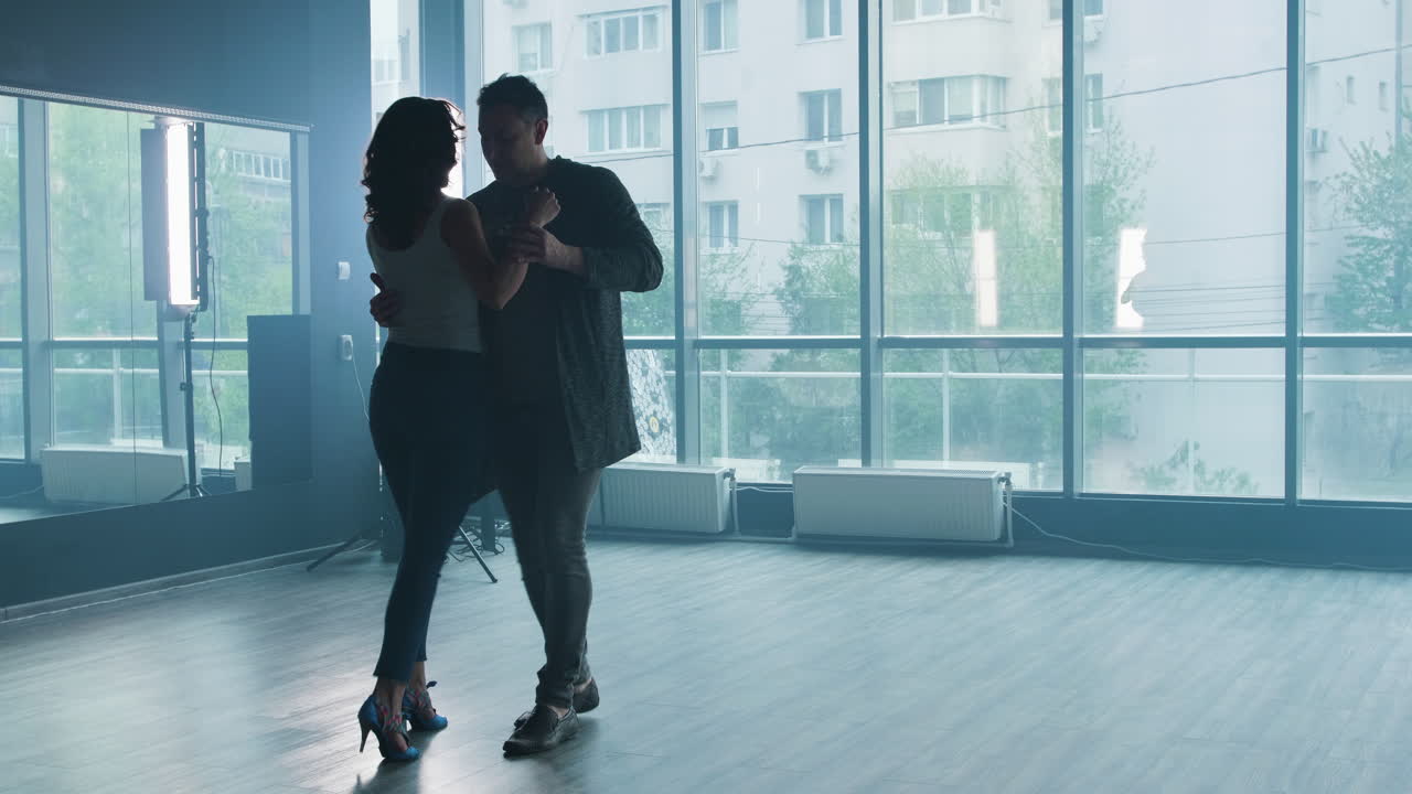 A couple dancing in a studio