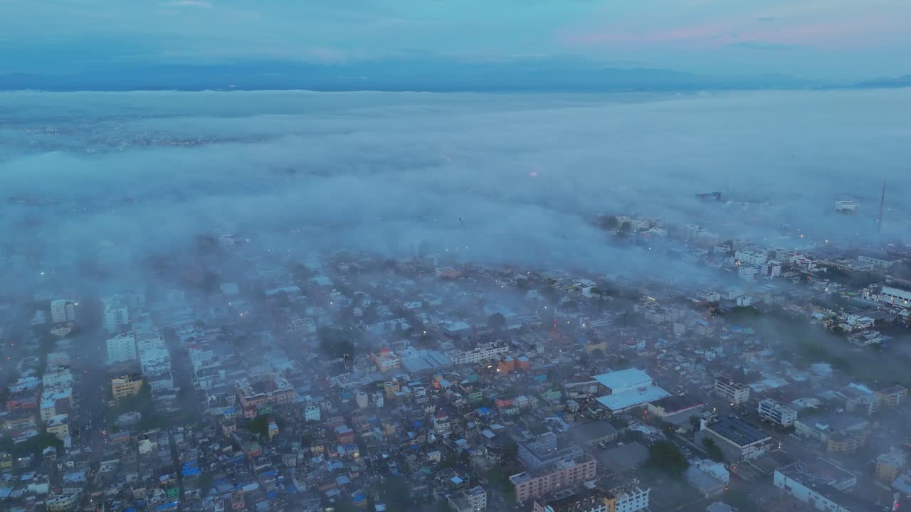 Santo Domingo in Fog: Aerial Views of the City’s Skyline and Streets Covered in Morning Mist and Low Visibility