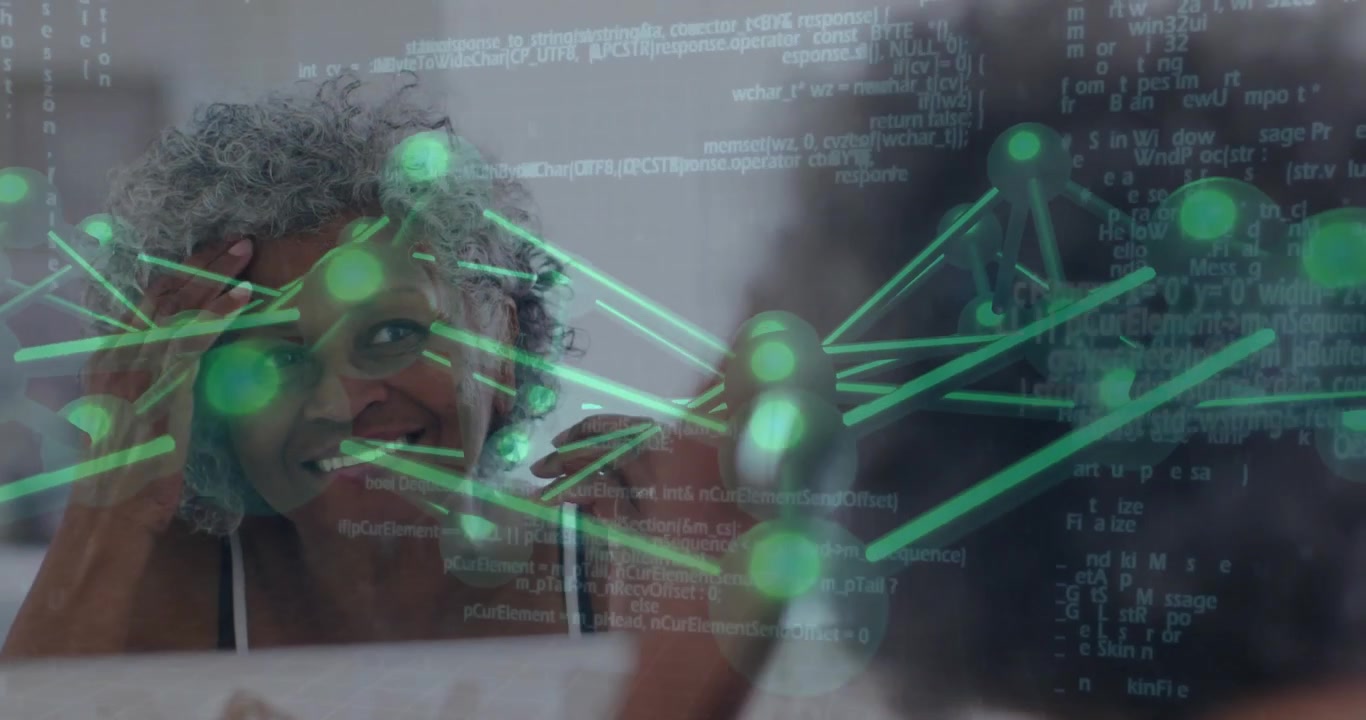 senior woman focusing at desk, interacting with holographic neural network code in tech environment
