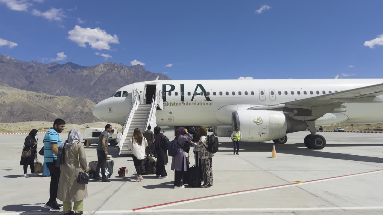 Slow Motion View of People on Runway of Skardu Airport, Pakistan after Pakistan International Airlines Flight