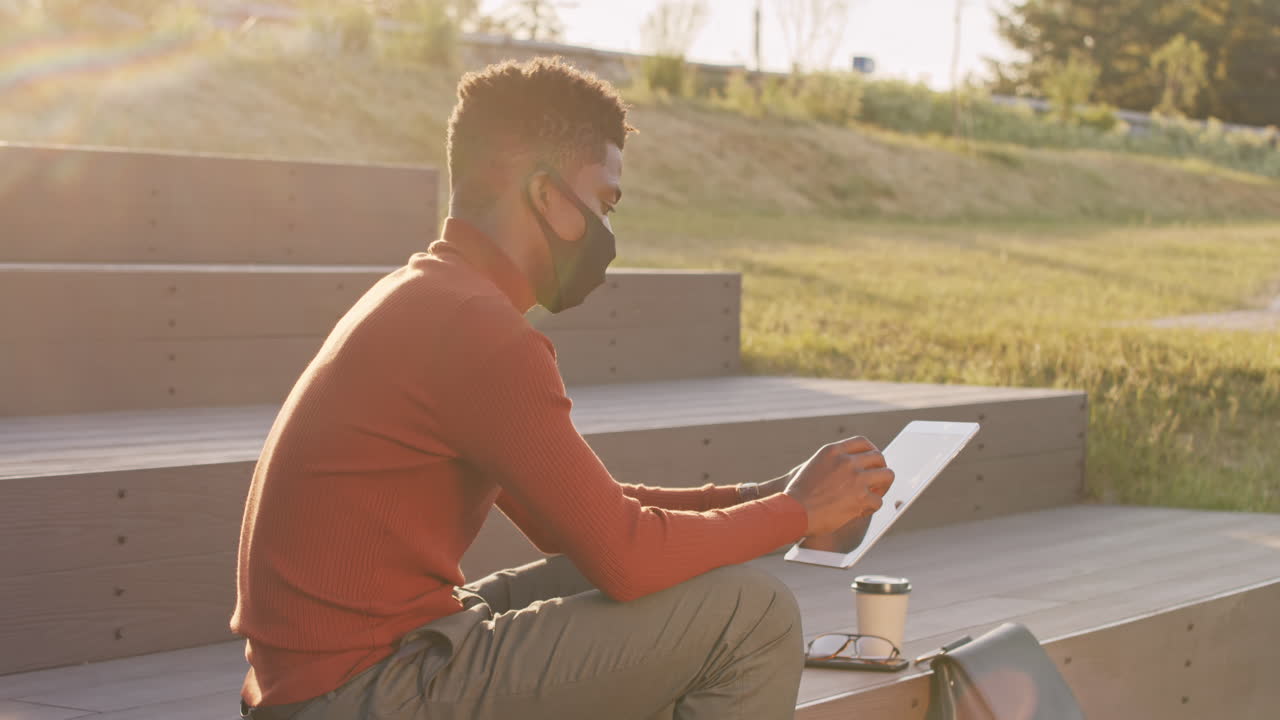 African American Businessman in Face Mask Working Outdoors