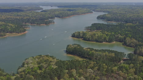 lake allatoona georgia aerial v2 tilt up shot of serene landscape of lake allatoona, red top mountain state park and wild forest - april 2020