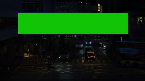 Night-city-street-billboard-stand-with-green-screen