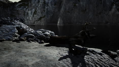 black sand beach hidden between blurred volcanic rocks