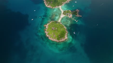 birds eye tilt up reveal shot of koh nang yuan island, koh tao in thailand