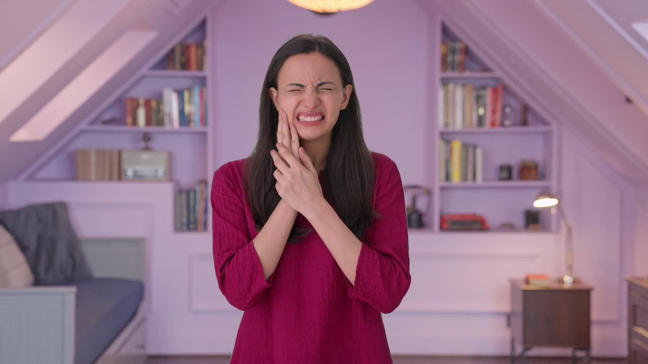 Sick Indian woman suffering from toothache