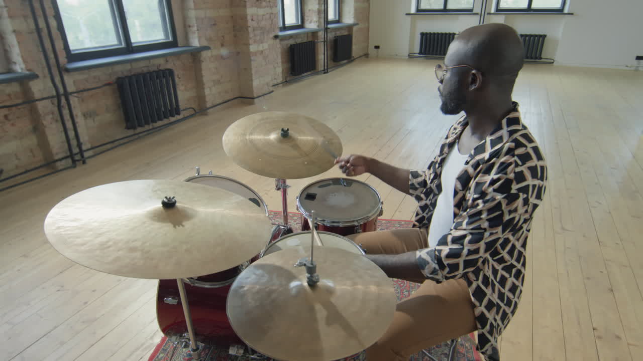African American Drummer Playing Drumset
