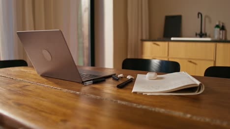 home office workspace with laptop and notebook