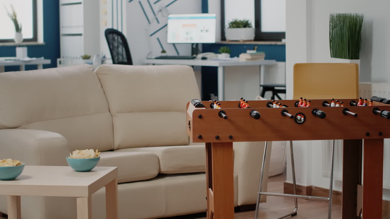 Nobody in business workplace with foosball table and couch