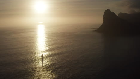 yacht sails on sea at sunset