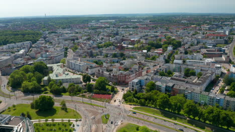 Aerial-view-of-urban-neighbourhood.-Low-traffic-at-multilane-city-circuit-leading-around