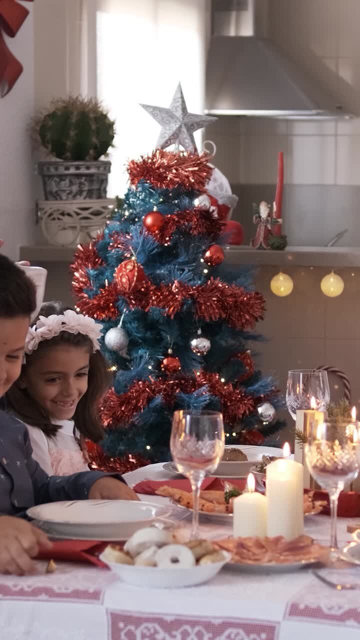 Mother serving food to her happy family at Christmas