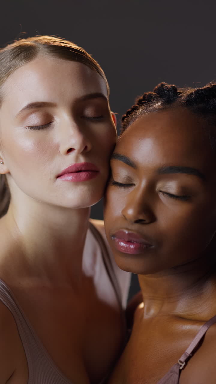Two women of different races posing together