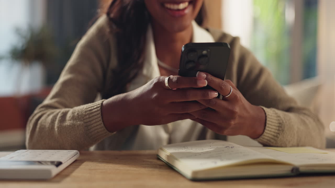 Woman using phone at desk