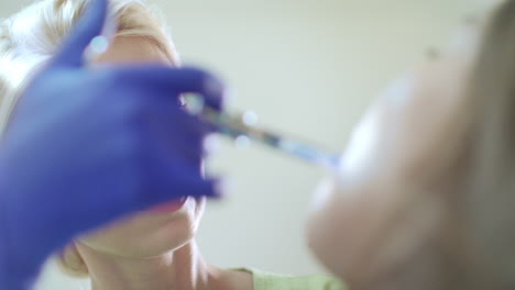 female doctor making medicine injection with syringe