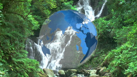 rotating globe in front of water falls