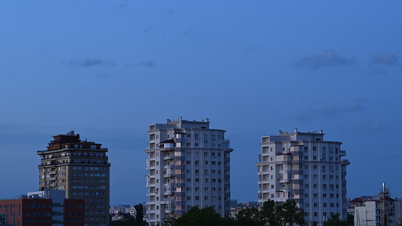 Time lapse of modern residential buildings under soft evening light and cloudy sky