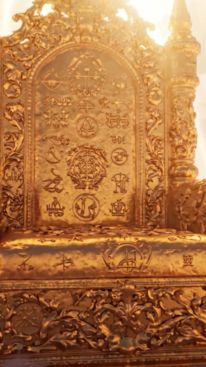 A majestic golden throne adorned with intricate symbols and patterns, ascending through soft clouds, radiating an aura of divinity and grandeur against a vibrant background of light.