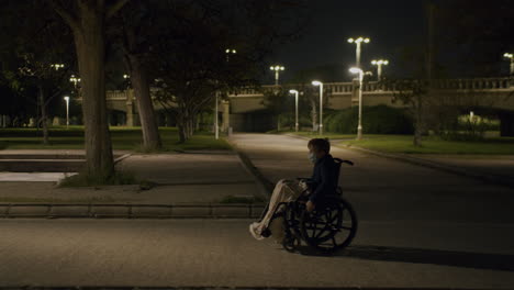 lonely walk of a disabled kid in evening park