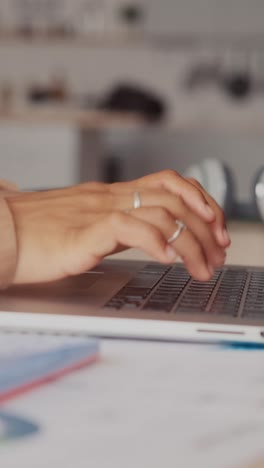 close up of hands of woman secretary typing text on laptop keyboard
