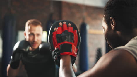 sports trainer, man and boxer punch training