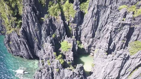 4k aerial drone view of secret lagoon in miniloc island, palawan, philippines