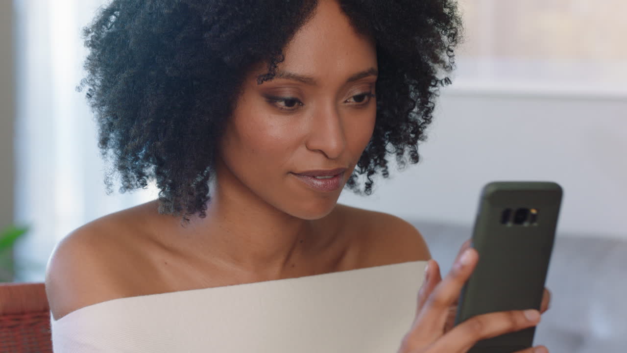 beautiful woman using smartphone texting browsing social media messages enjoying mobile phone communication at home