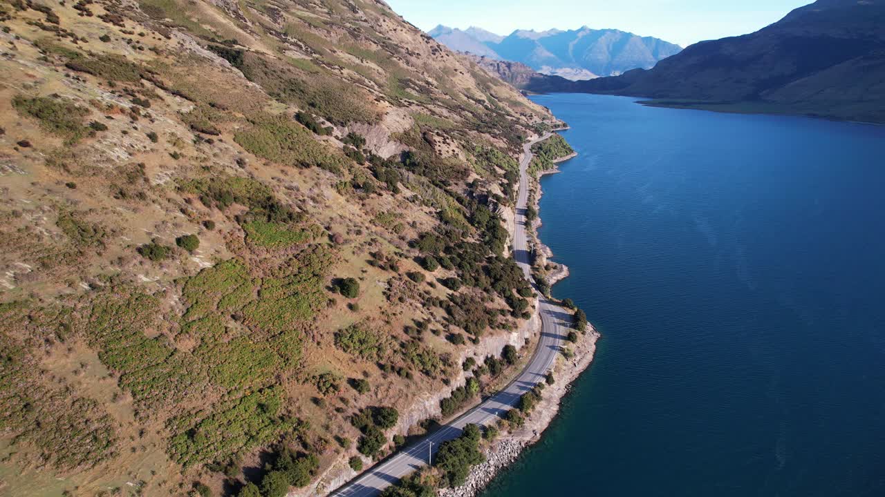 Highway Road With Lake Hawea And Mountains, South Island, New Zealand - Aerial Drone Shot