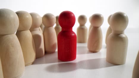 Wooden Figures Representing Leadership and Individuality