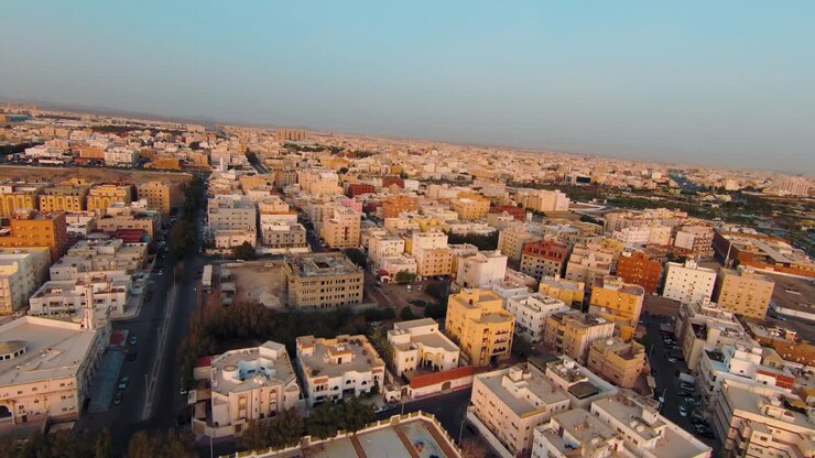 Dolly Shot of an FPV Drone Soaring Over the Cityscape of Jeddah, Saudi Arabia