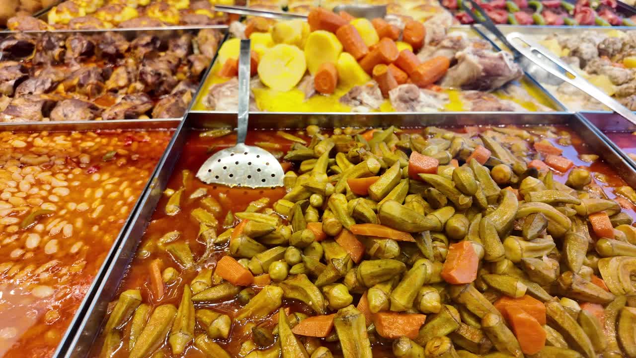 Food display featuring okra and carrots